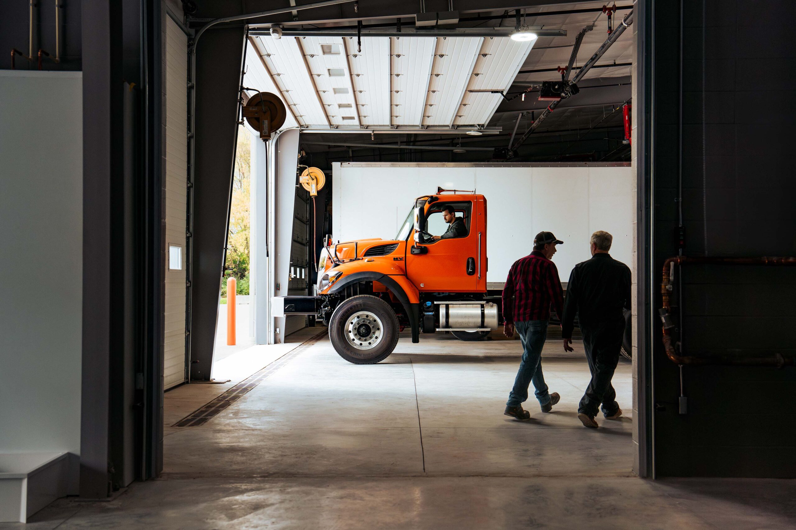 Technician working in a commercial truck service bay